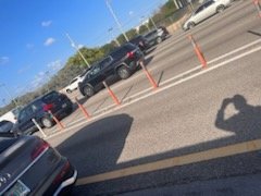 Scene photo showing orange traffic delineators separating express lanes from regular lanes on a Florida highway, taken by the claimant after the crash.